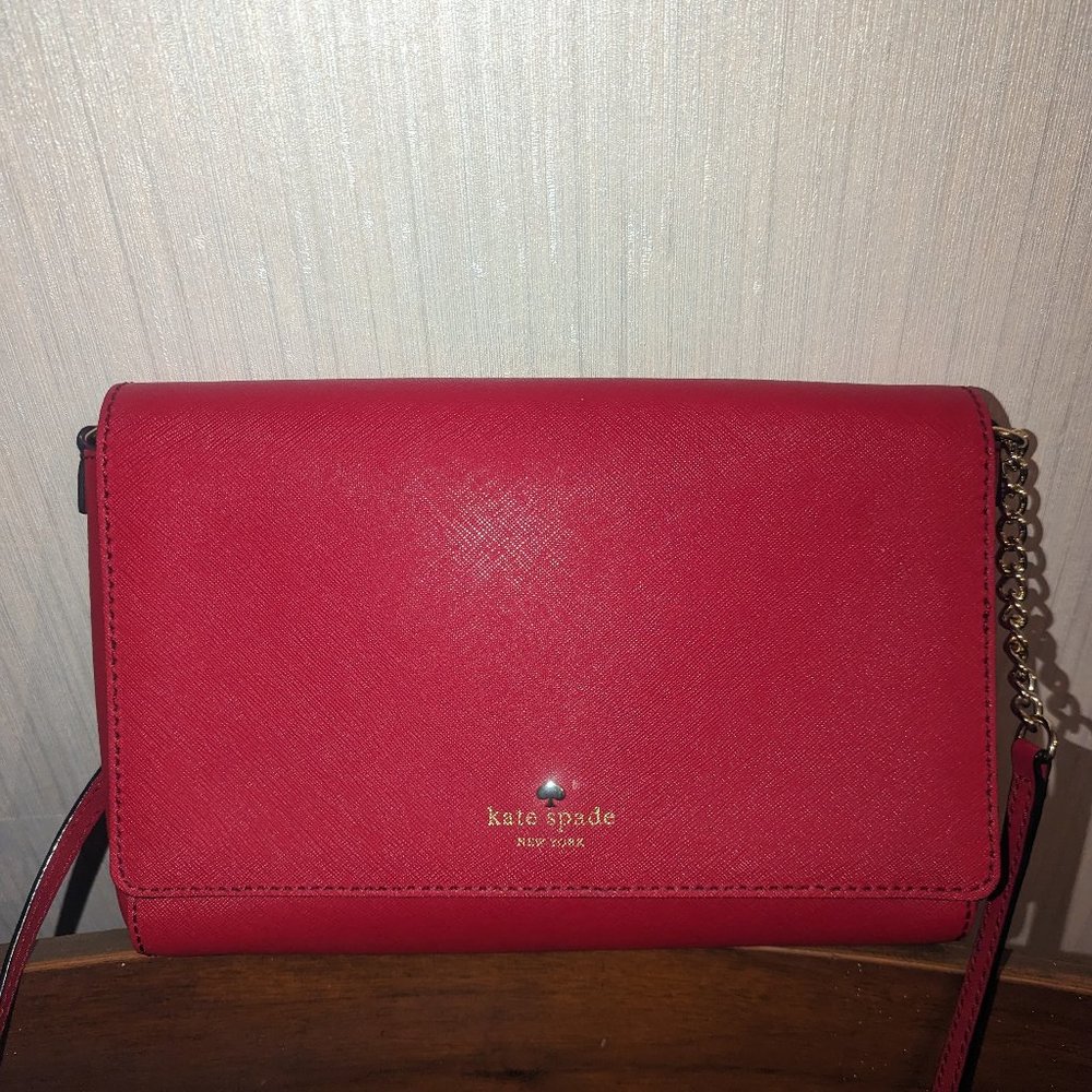 Kate Spade envelope style crossbody bag in red saffiano leather.